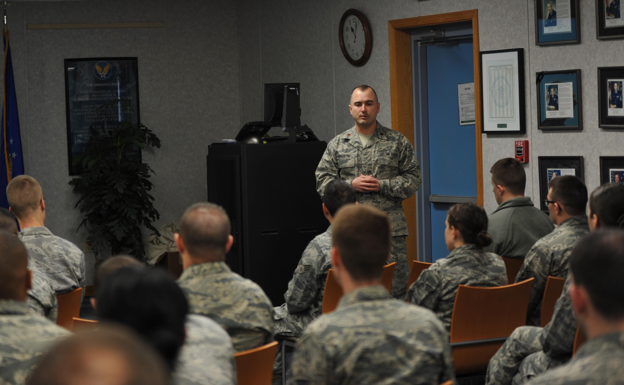 Maj. Peter Gruters introduces his famed uncle, Capt. (ret.) Guy Gruters, prior to Guy's speech at Airman Leadership School Jan. 22, 2014, at Fort George G. Meade, Md. Guy sat for nearly five and a half years as a prisoner of war at the notorious Hanoi Hilton. Peter is the director of operations with the 34th Intelligence Squadron. (U.S. Air Force photo/Airman 1st Class Samuel Daub)