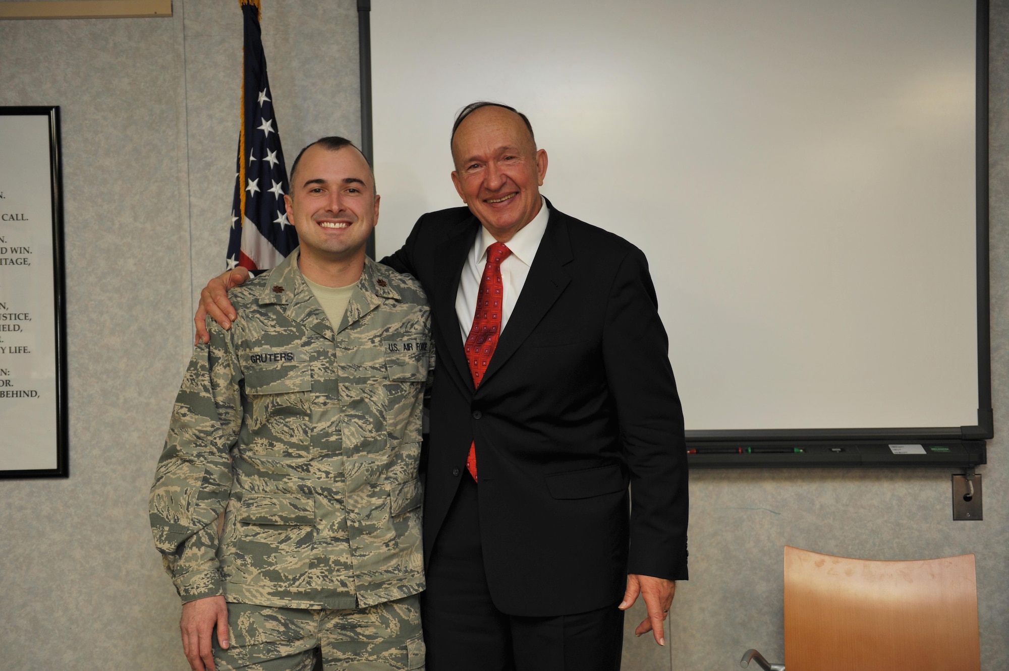 Maj. Peter Gruters stands with his Uncle, Capt. (ret.) Guy Gruters, after Guy's speech Jan. 22, 2014, at Airman Leadership School on Fort George G. Meade, Md. Peter joined the Air Force to continue his famed uncle's legacy. Peter is the director of operations with the 34th Intelligence Squadron. (U.S. Air Force photo/Airman 1st Class Samuel Daub) 