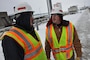 Jim Rand, U.S. Army Corps of Engineers, St. Paul District, Lock and Dam 8 lockmaster, left, and Joe Schroetter, U.S. Army Corps of Engineers, St. Paul District,project manager, discuss the winter maintenance at Lock and Dam 8, near Genoa, Wis., Jan 14.