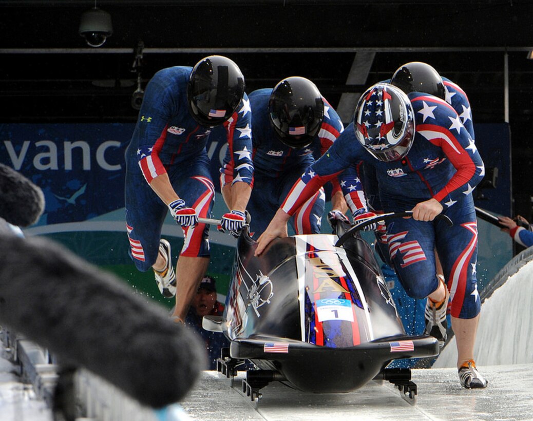 Former U.S. Army World Class Athlete Program bobsledder Steven Holcomb (front right) leads "The Night Train" team of WCAP Sgt. Justin Olsen, Steve Mesler and Curtis Tomasevicz to a start time of 4.77 seconds in the third heat of the Olympic four-man bobsled event. The quartet won an Olympic gold medal in bobsleigh for Team USA for the first time in 62 years at the Whistler Sliding Centre during the 2010 Olympic Winter Games. Nine Soldiers have been named to the 2014 Sochi Winter Olympics including Sgt Justin Olsen pictured here.  U.S. Army photo by Tim Hipps, IMCOM G9 MWR Public Affairs