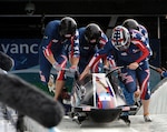 Former U.S. Army World Class Athlete Program bobsledder Steven Holcomb (front right) leads 