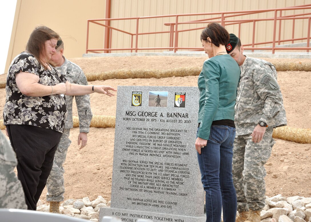 YUMA PROVING GROUND, Ariz. – Sheila Long (left) and Michelle Bannar (right) unveil the plaque honoring Master Sgt. George A. Bannar, Long’s son and Bannar’s husband who was killed in action in Afghanistan in 2013, during the ribbon cutting ceremony for the new vertical wind tunnel facility, which is named in his honor, held on Yuma Proving Ground Jan. 24. The U.S. Army Corps of Engineers Los Angeles District constructed the $10 million facility, which can allow up to eight fully-loaded Soldiers, Sailors, Marines or Airmen to practice their skydiving techniques. 