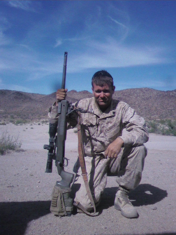 Sgt. David Mortensen poses for a photo with an M40 A5 rifle in an undated photograph at the Marine Corps Air Ground Combat Center 29 Palms, Calif. Mortensen was the first winner of the Marine Corps Scout Sniper Instructor of the Year Award.  