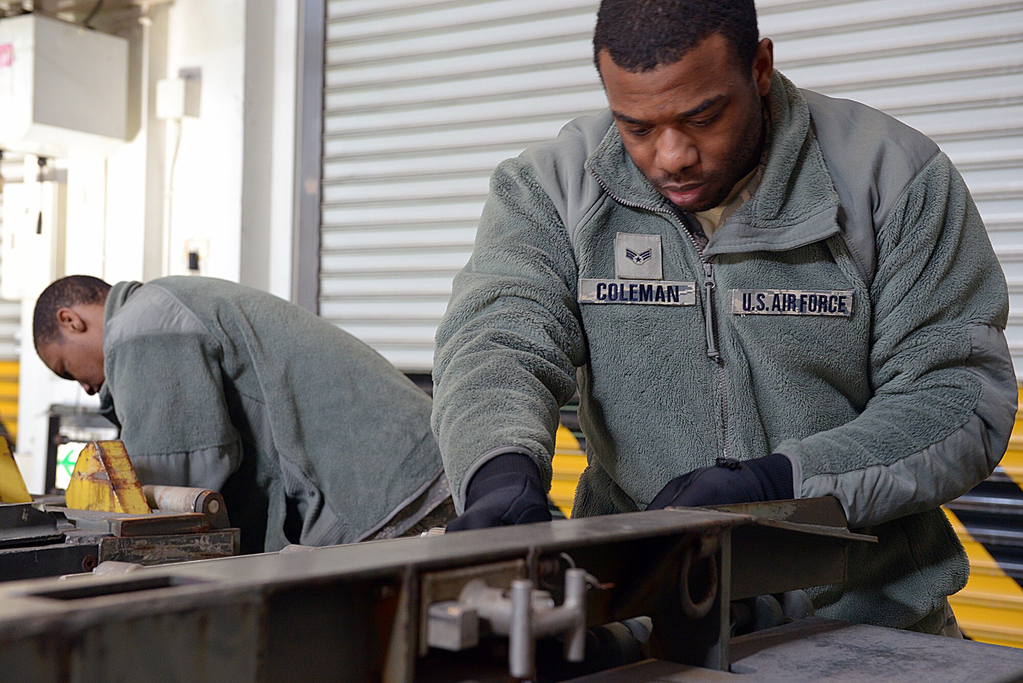 Senior Airman Darryl Coleman Jr., 374th Logistics Readiness Squadron vehicle management analyst, configures a Halverson 25K loader for shipping at Yokota Air Base, Japan, Jan. 24, 2014. The Halvorsen Loader is a mechanized aircraft loader that can transport and lift up to 25,000 pounds of cargo and load it onto military and civilian aircraft. (U.S. Air Force photo by Airman 1st Class David Danford/Released)