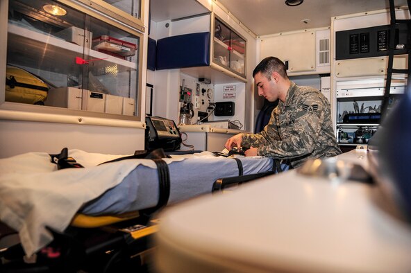 Senior Airman Jeremy Anderson, 354th Medical Operations Squadron ambulance crew member, inspects a gurney during a change-of-shift checklist procedure Jan. 24, 2014, Eielson Air Force Base, Alaska. As an ambulance crew member, Anderson is responsible for the transport of victims to emergency medical facilities in the event of a crisis. (U.S. Air Force photo by Senior Airman Zachary Perras/Released)