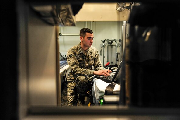 Senior Airman Jeremy Anderson, 354th Medical Operations Squadron ambulance crew member, tests equipment during a change-of-shift checklist procedure Jan. 24, 2014, Eielson Air Force Base, Alaska. Ambulance gear must be properly inspected at every shift-change to ensure functionality and efficiency. (U.S. Air Force photo by Senior Airman Zachary Perras/Released)
