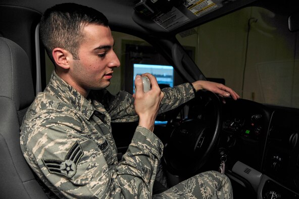 Senior Airman Jeremy Anderson, 354th Medical Operations Squadron ambulance crew member, tests the ambulance radio during a change-of-shift checklist procedure Jan. 24, 2014, Eielson Air Force Base, Alaska. Anderson performs 24-hour on-call shifts on a rotational basis and must respond to emergencies on base. (U.S. Air Force photo by Senior Airman Zachary Perras/Released)