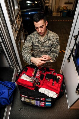 Senior Airman Jeremy Anderson, 354th Medical Operations Squadron ambulance crew member, inspects ambulance equipment during a change-of-shift checklist procedure Jan. 24, 2014, Eielson Air Force Base, Alaska. Ambulance crew members are responsible for the safety and transport of victims to emergency medical facilities in the event of a crisis. (U.S. Air Force photo by Senior Airman Zachary Perras/Released)