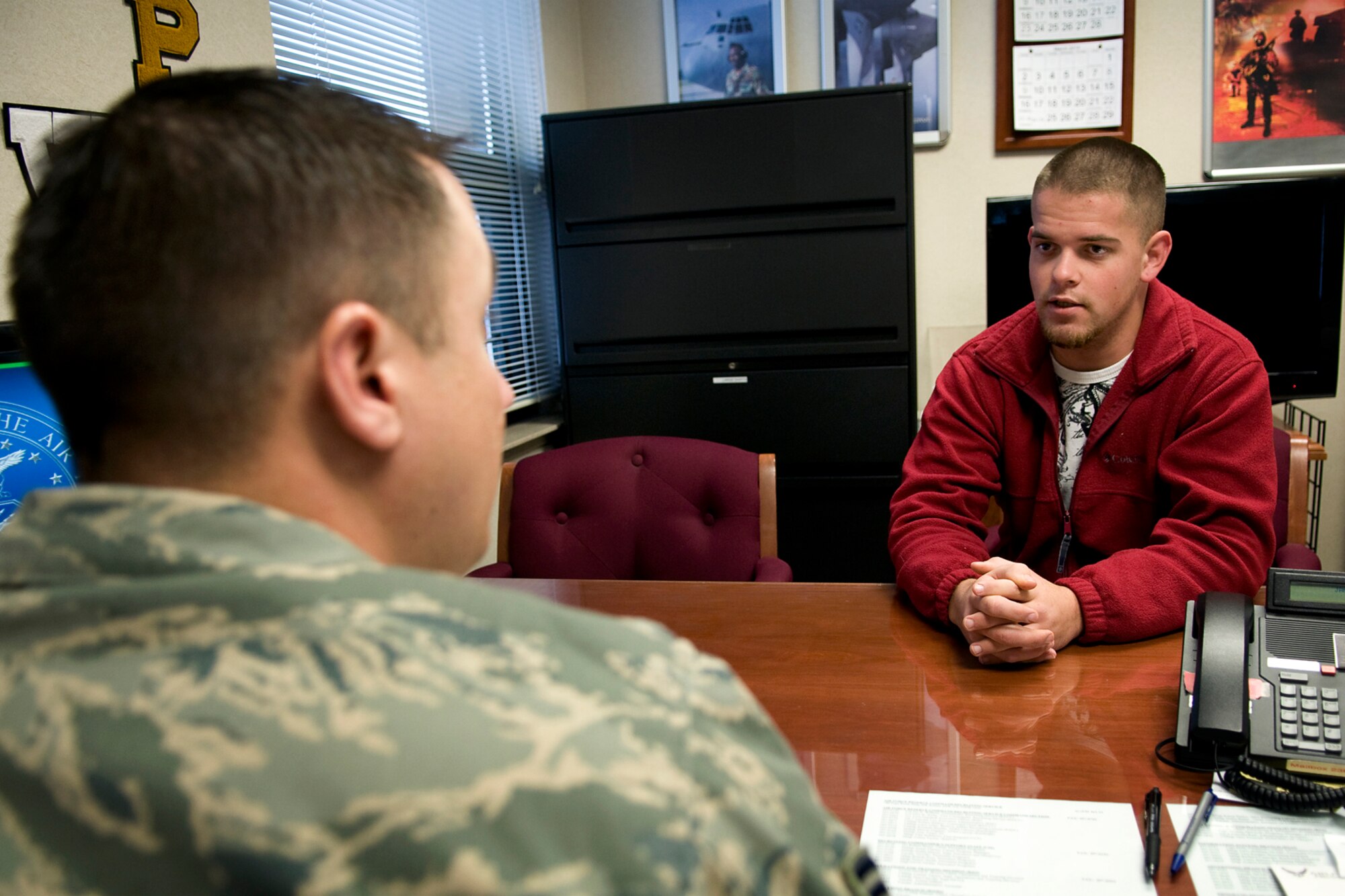 U.S. Army National Guard Pvt. 1st Class Mitchell Wooten talks with U.S. Air Force Tech. Sgt. Craig Ridener, 434th Air Refueling Wing recruiter, as he inquires about opportunities in the Air Force Reserve at Grissom Air Reserve Base, Ind., Jan. 15, 2014. The Air Force Reserve Command is now actively seeking Airmen who want to serve as full-time recruiters on active-guard and reserve tours. (U.S. Air Force photo/Tech. Sgt. Mark R. W. Orders-Woempner) 