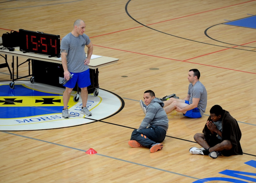 Dyess Airmen rest in the Fitness Center during a Warrior Challenge Jan. 24, 2014, at Dyess Air Force Base, Texas. The competitors executed multiple exercises in a timed circuit during this year’s first competition, there will be two more held this year. (U.S. Air Force photo by Senior Airman Shannon Hall/Released)