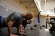 U.S. Air Force Tech. Sgt. Kaipo Cowan, 372nd Training Squadron, performs push-ups Jan. 24, 2014, at Dyess Air Force Base, Texas. Cowan was a contestant in this years Warrior Challenge, hosted by the Dyess Fitness Center. He was timed on how quickly he could accomplish different exercises within a circuit. (U.S. Air Force photo by Airman 1st Class Alexander Guerrero/Released)