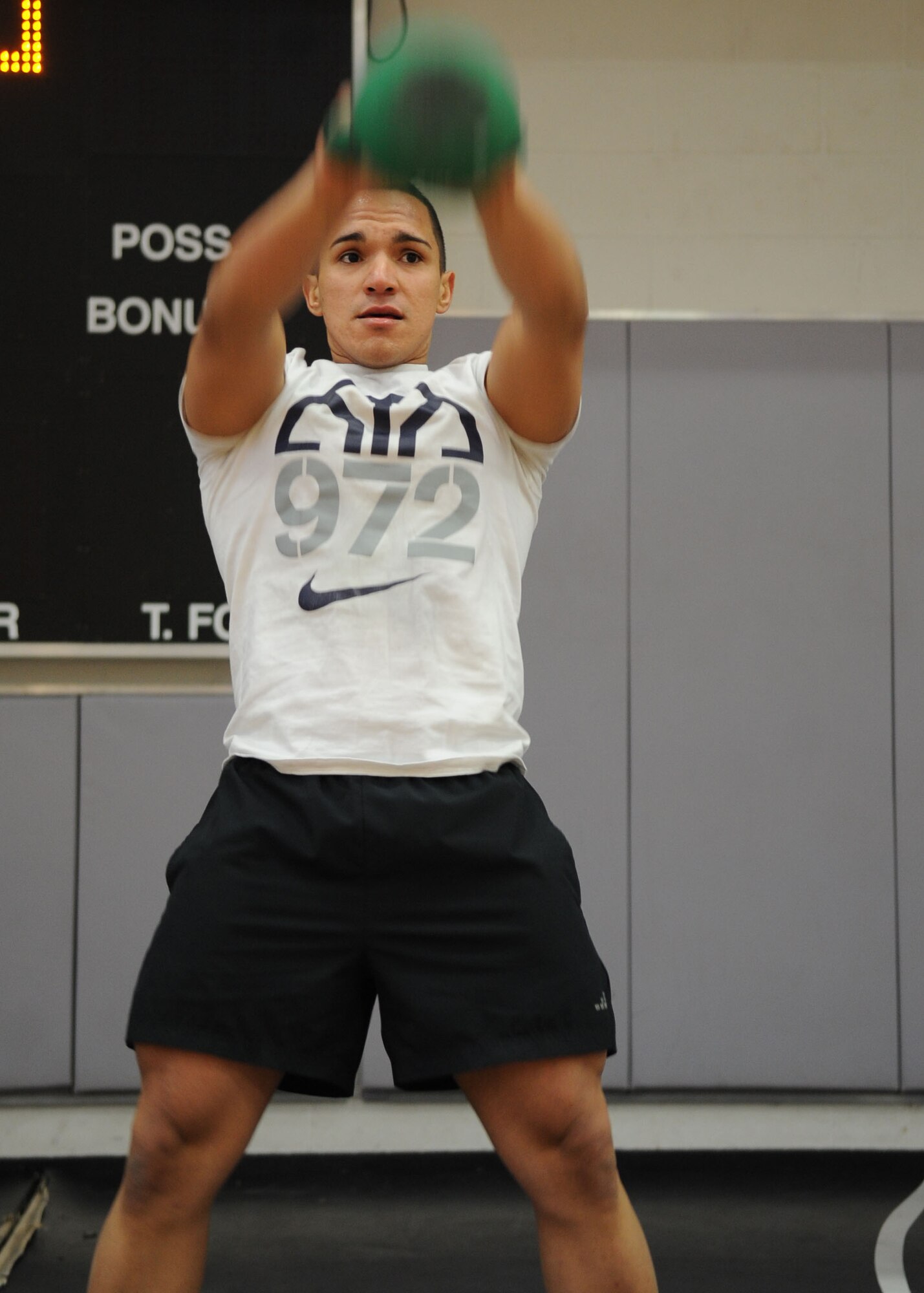 U.S. Air Force Senior Airman Joshua Massas-Borges, 7th Equipment Maintenance Squadron, performs a kettle bell swing Jan. 24, 2014, at Dyess Air Force Base, Texas. Borges participated in the Warrior Challenge, where he had to complete different exercises such as deadlifting 205 pounds, 15 pyramid push-ups, 25 box jumps and more. He finished in third place with a time of 24:46. (U.S. Air Force photo by Senior Airman Shannon Hall/Released)
