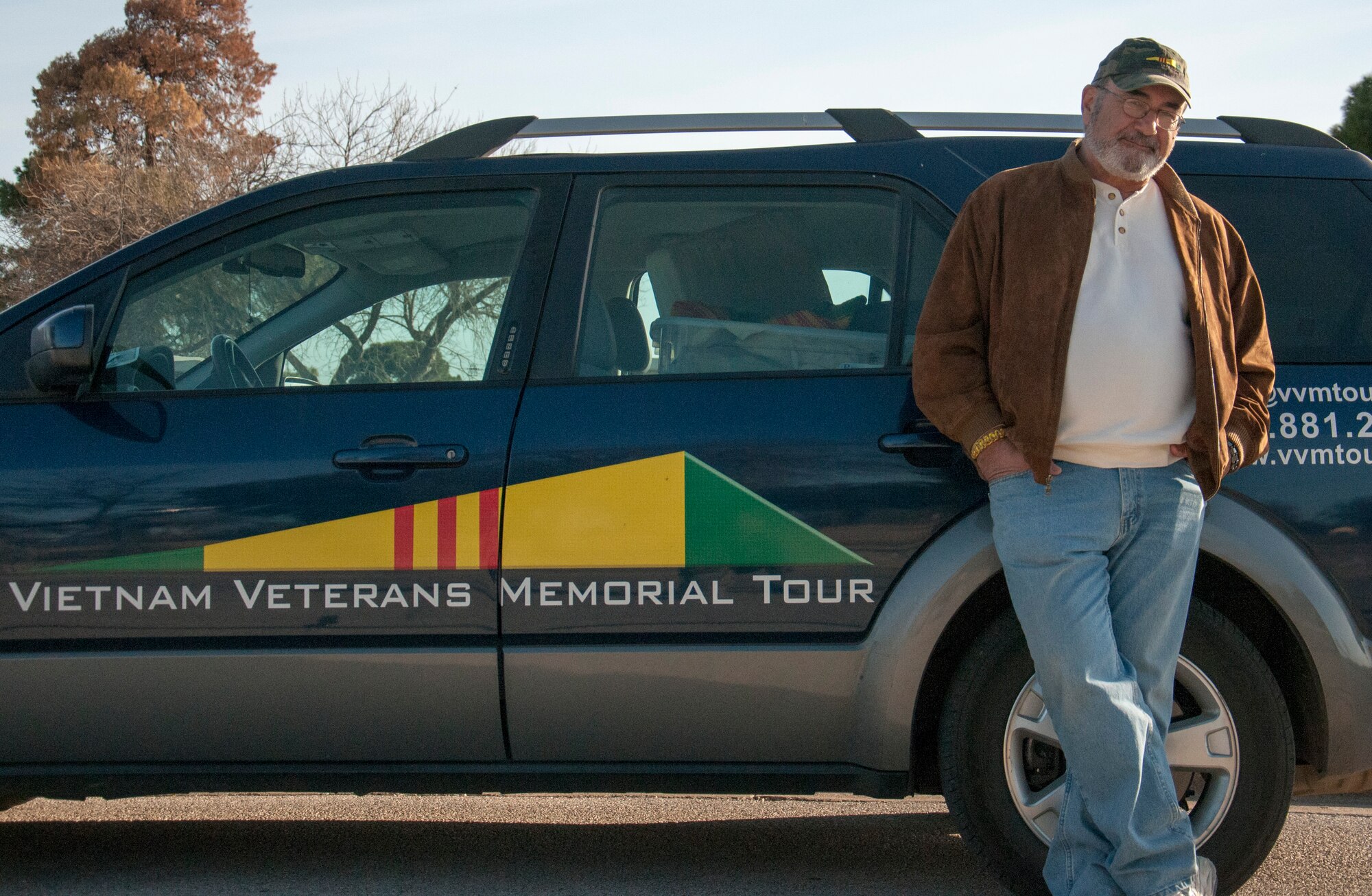Bruce Campbell, Vietnam veteran, stands by his touring vehicle at Laughlin Air Force Base, Texas, Jan. 24, 2013. Campbell visited the memorial of 22 Laughlin instructor pilots, who gave their lives in the Vietnam War, as part of his tour. (U.S. Air Force photo/Airman 1st Class Jimmie D. Pike)