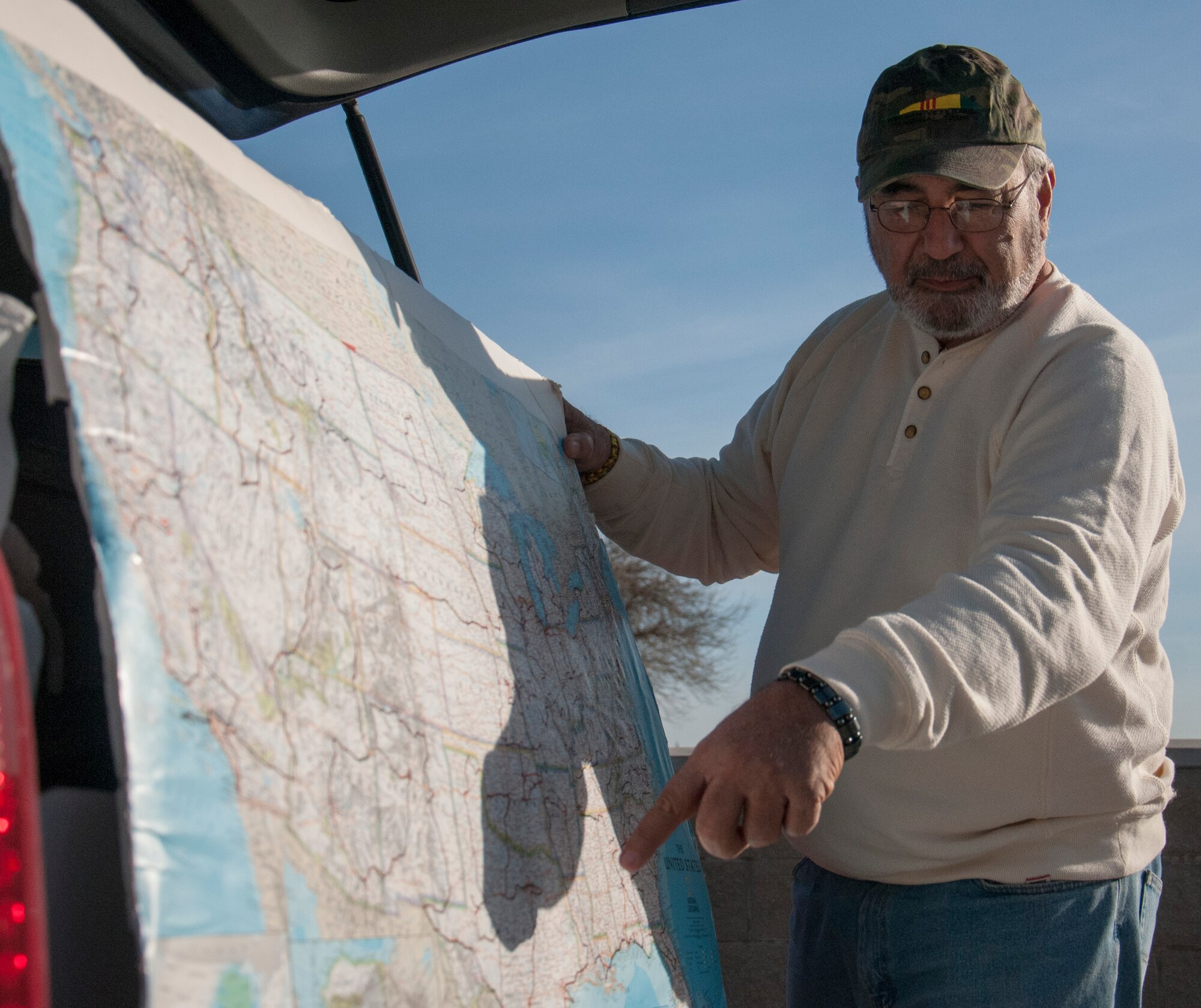 Bruce Campbell, Vietnam veteran, points to part of the route he is taking through Texas on his trip to visit Vietnam memorials in the U.S., at Laughlin Air Force Base, Texas, Jan. 24, 2013. Campbell visited the memorial of 22 Laughlin instructor pilots, who gave their lives in the Vietnam War, as part of his tour. (U.S. Air Force photo/Airman 1st Class Jimmie D. Pike)
