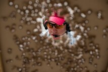 U.S. Air Force Senior Airman Donald Bacha, 23d Security Forces Squadron combat arms training and maintenance (CATM) instructor, checks a target during M4 carbine qualifications at Moody Air Force Base, Ga., Jan. 28, 2014. Airmen attempting to qualify on the M4 carbine fired a total of 196 shots. (U.S. Air Force photo by Airman 1st Class Ryan Callaghan/Released)
