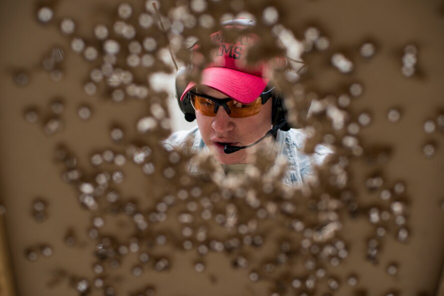 U.S. Air Force Senior Airman Donald Bacha, 23d Security Forces Squadron combat arms training and maintenance (CATM) instructor, checks a target during M4 carbine qualifications at Moody Air Force Base, Ga., Jan. 28, 2014. Airmen attempting to qualify on the M4 carbine fired a total of 196 shots. (U.S. Air Force photo by Airman 1st Class Ryan Callaghan/Released)
