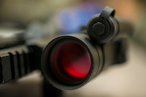 An M4 carbine with a “red-dot” scope attached lies on a table during weapon reassembly training at Moody Air Force Base, Ga., Jan. 28, 2014. Airmen learned how to disassemble, clean and reassemble their weapon, as well as proper handling and firing procedures. (U.S. Air Force photo by Airman 1st Class Ryan Callaghan/Released)
