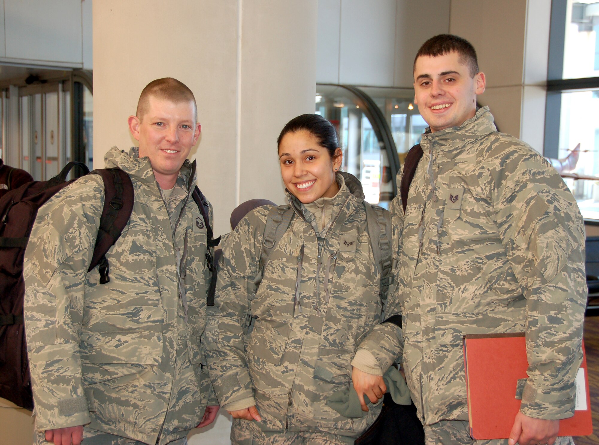 Master Sgt. Chris Jones, Senior Airman Vanessa Hernandez, and Staff Sgt. Vitaliy Gorbachyk,  three Airmen from the 103rd Force Support Squadron at Bradley Air National Guard Base, East Granby, Conn., said farewell to their loved ones and boarded an aircraft bound for a deployed location in Southwest Asia on Jan. 23, 2014.  (U.S. Air National Guard photo by Maj. Bryon M. Turner)