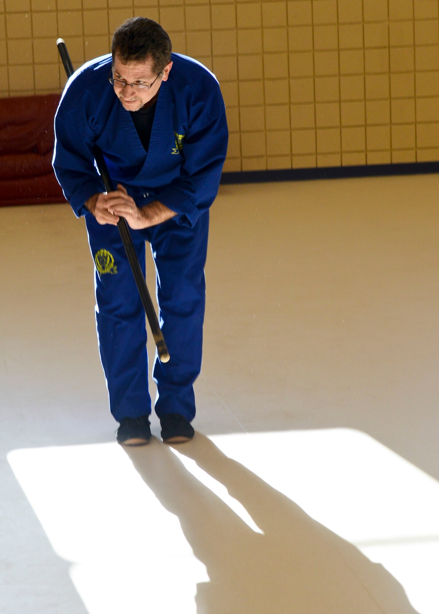 Ray Snyder, D.H.S. Martial Arts student, performs a demonstration after the Community Commons ribbon-cutting ceremony at Langley Air Force Base, Va., Jan 24, 2014. The new Community Commons, previously known as the Community Center, provides a central location for recreational and leisure activities for all base personnel, including trips, events and many different classes. (U.S. Air Force photo by Airman 1st Class Victoria H. Taylor/Released)