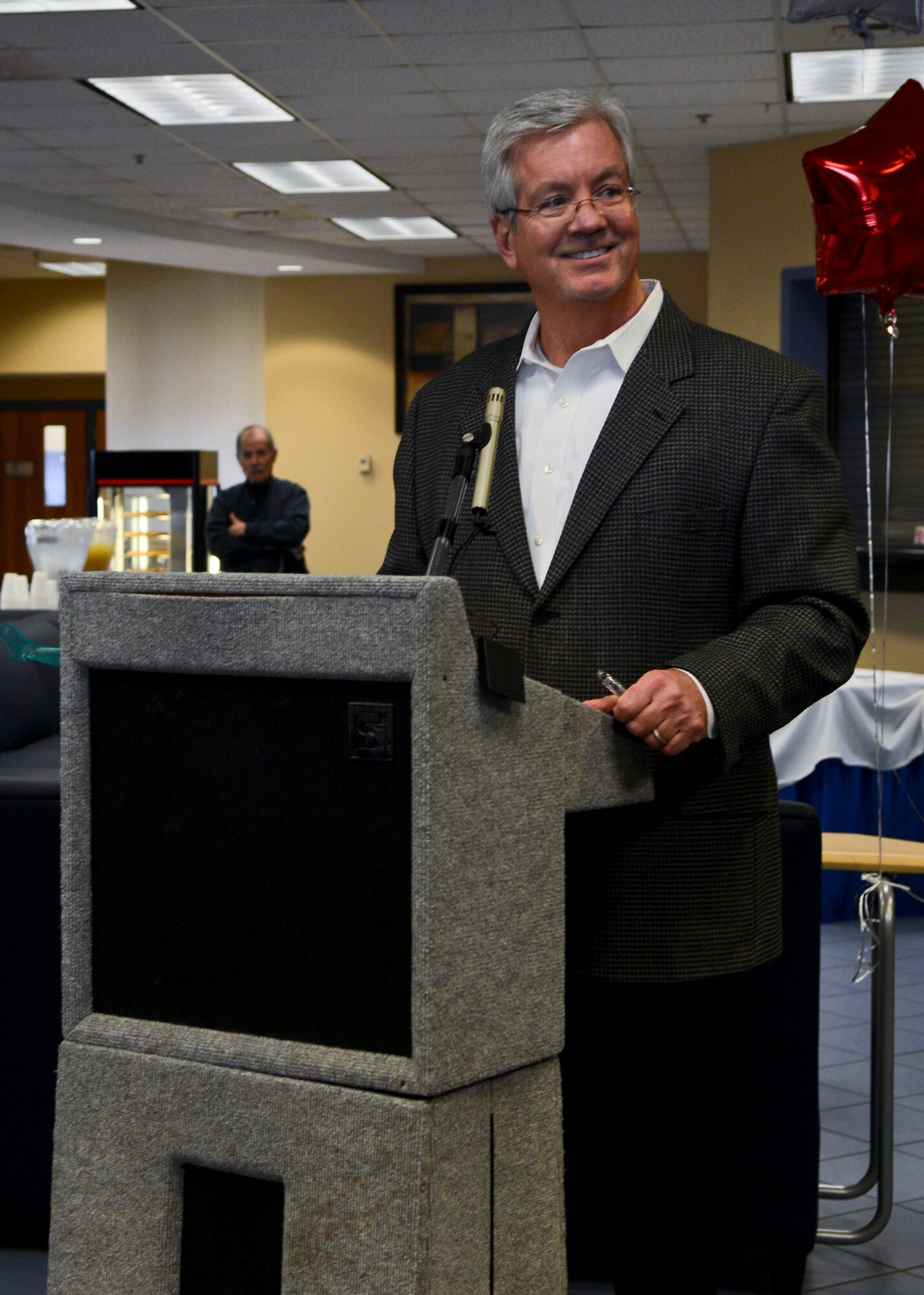 John Flood, 633rd Force Support Squadron deputy director, speaks during the Community Commons ribbon-cutting ceremony at Langley Air Force Base, Va., Jan. 24, 2014. The new Community Commons is home to the Airman's Attic, Thrift Shop, Information Tickets and Travel, and Heidi's Cinderella Closet. (U.S. Air Force photo by Airman 1st Class Victoria H. Taylor/Released)