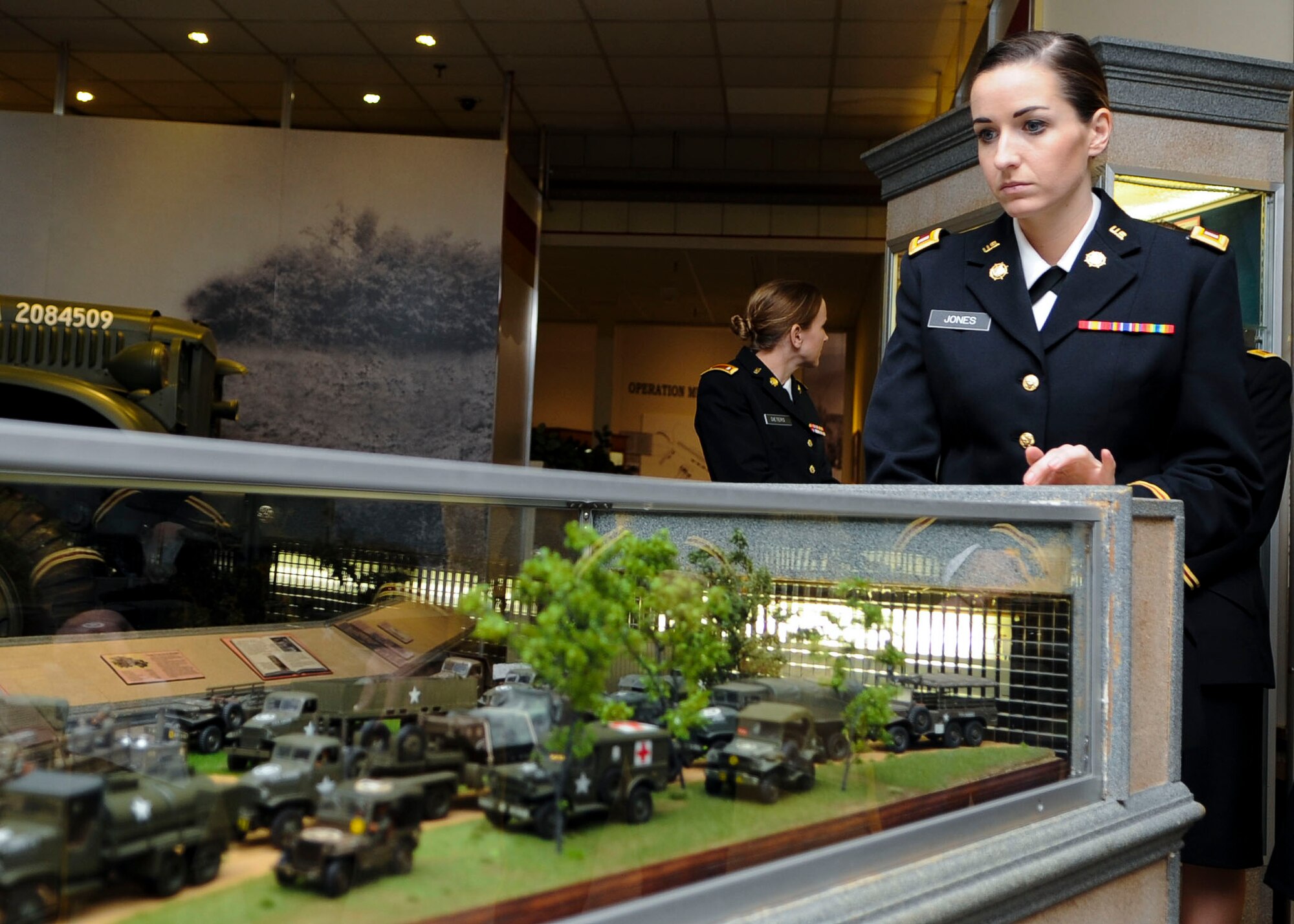 U.S. Army 1st Lt. Demi Jones, 84th Ordnance Battalion movement control specialist, views an exhibit in the U.S. Army Transportation Museum at Fort Eustis, Va., Jan. 28, 2014. According to museum staff, almost every museum exhibit piece is genuine, and some were even used in combat missions. Jones hails from Tampa, Fl. (U.S. Air Force photo by Airman 1st Class Austin Harvill/Released)