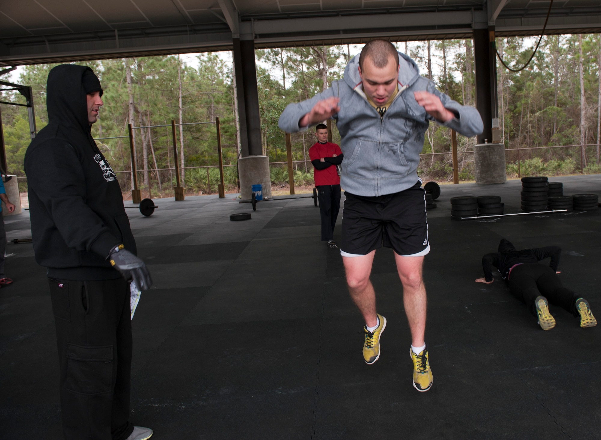 Senior Airman Braden Irby, 1st Special Operations Communications Squadron unit deployment manager, performs a burpee exercise during the King and Queen of the Gym compettion at Hulrburt Field, Fla., Jan. 24, 2014. A burpee is a full-body exercise which consist of going to and from a pushup position then leaping in the air. (U.S. Air Force photo/Senior Airman Krystal M. Garrett) 