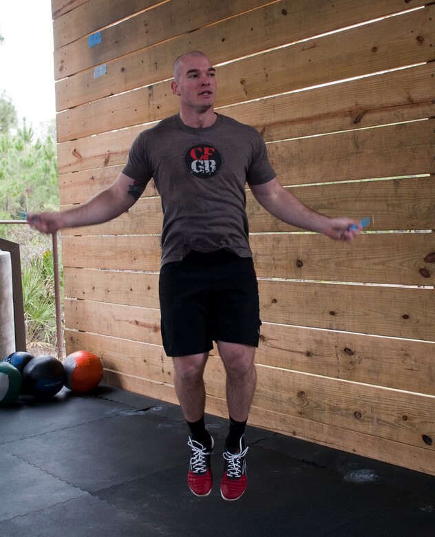 Airman 1st Class Johnathon Broy, 1st Special Operations Aerospace Medicine Squadron public health technician, performs jump rope double-unders during the King and Queen of the Gym competition at Hurlburt Field, Fla., Jan 24, 2014. A jump rope double -under is an exercise where the rope makes two passes per jump. (U.S. Air Force photo/Senior Airman Krystal M. Garrett)