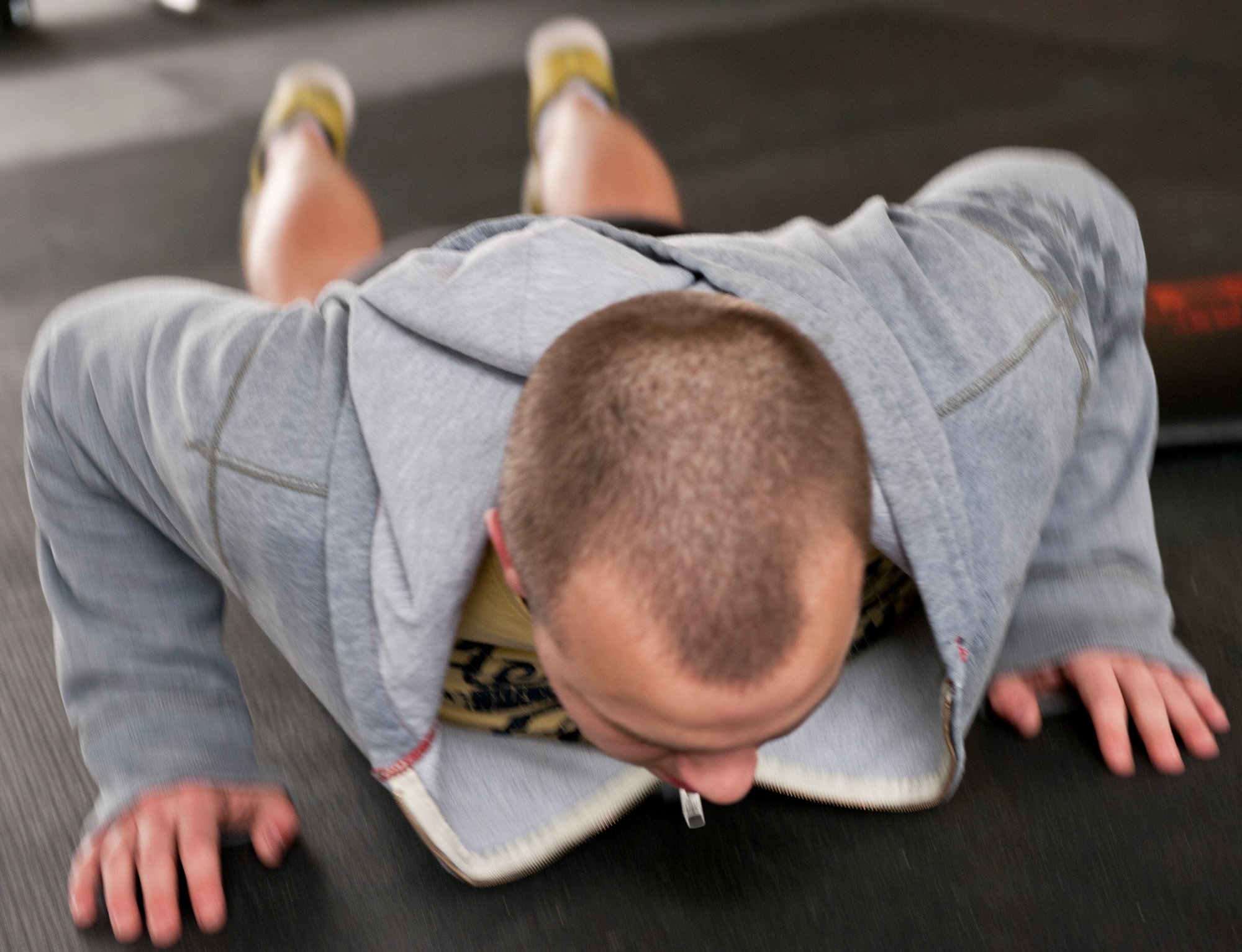 Senior Airman Braden Irby, 1st Special Operations Communications Squadron unit deployment manager, performs a pushup during the King and Queen of the Gym competition at Hurlburt Field, Fla., Jan. 24, 2014. Irby earned the title of Prince of the Gym for January. (U.S. Air Force photo/Senior Airman Krystal M. Garrett)