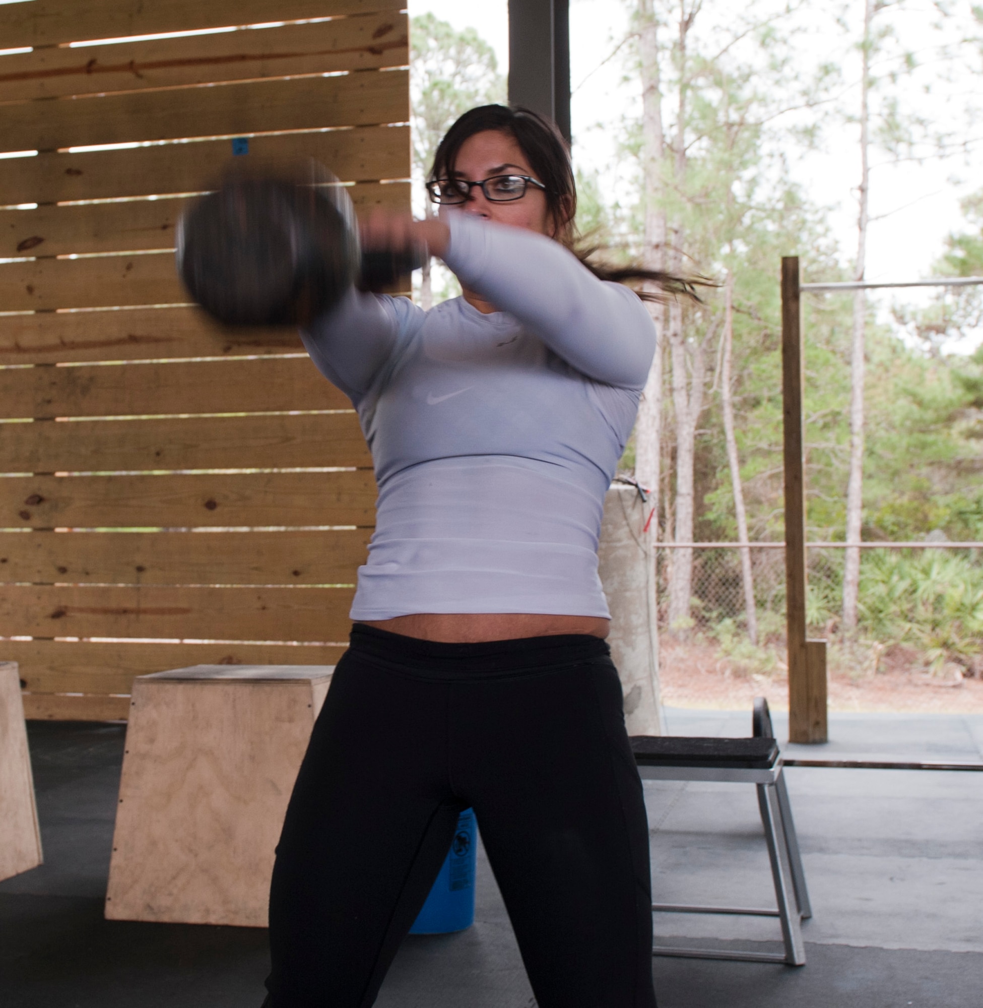 Staff Sgt. Summer Thorn, 1st Special Operations Logistics Readiness Squadron fuels distribution craftsman, performs a kettlebell swing during the King and Queen of the Gym competition at Hurlburt Field, Fla., Jan. 24, 2014. Participants completed multiple CrossFit exercises during the competition. (U.S. Air Force photo/Senior Airman Krystal M. Garrett)