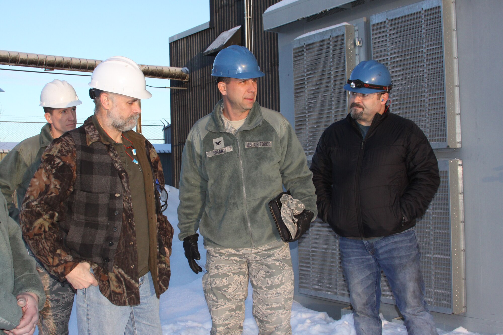 EARECKSON AIR STATION, Alaska -- (Left to right) Maj. Robert Young, 13th Space Warning Squadron, Leroy Sutton, Col. John Shaw, 21st Space Wing commander, and Andy Davis inspect the Clear Air Force Station combined heat and power plant. Shaw visited Clear AFS and the Cobra Dane operating location Jan. 10-14. This was Col Shaw's first visit to both Clear AFS and Cobra Dane. The 21st Operations Group assumed the Cobra Dane radar mission at Eareckson Air Station on Shemya Island, Alaska, April 1, 2013, and took responsibility for contract and program management Oct. 1. The radar is about 120 feet tall, the face is about 95 feet in diameter, and with its ability to detect objects about 2,000 miles away, it provides data for the Space Surveillance Network and the Ballistic Missile Defense System. (U.S. Air Force photo)