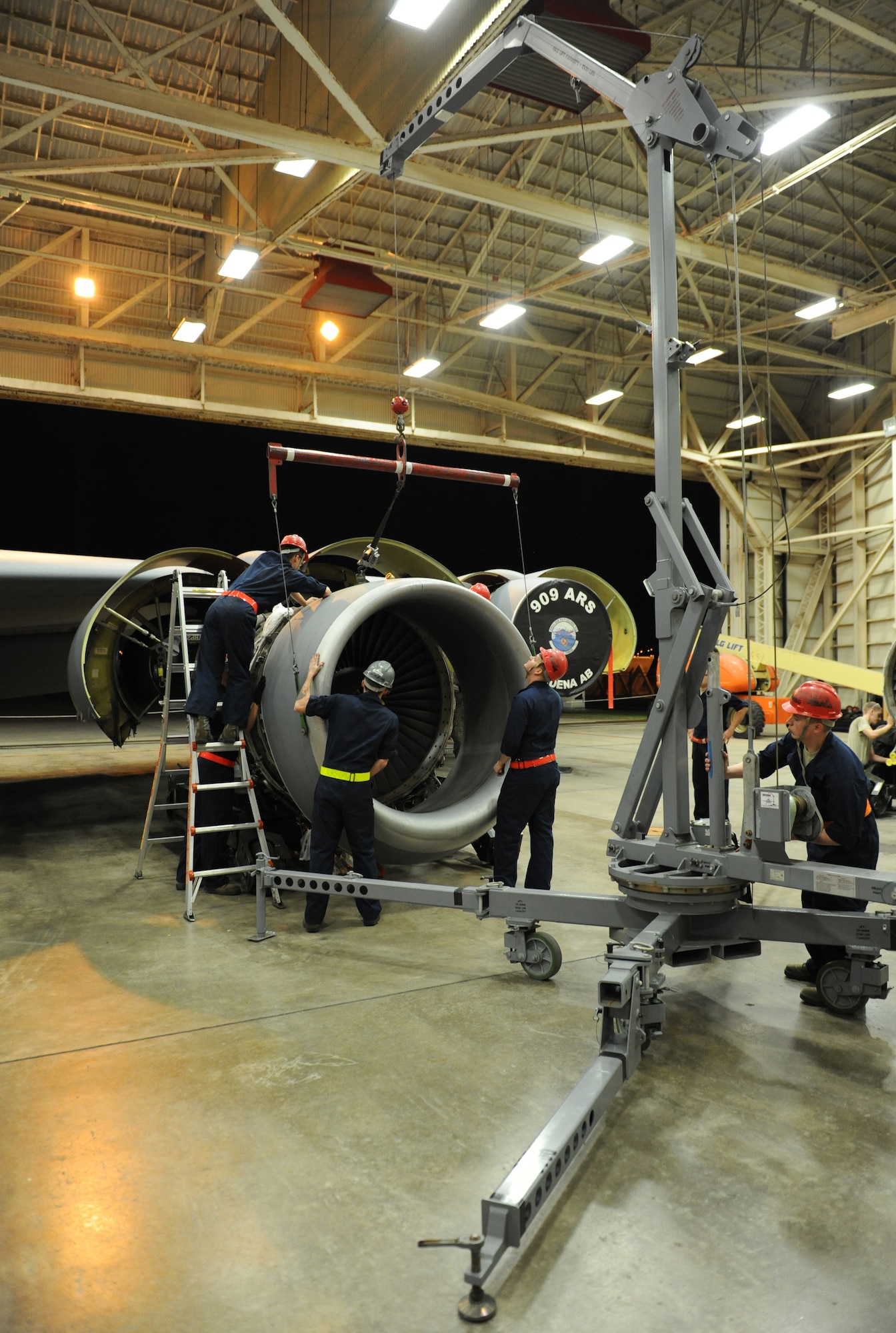 Members of the 718th Aircraft Maintenance Squadron remove an inlet cowl, to apply onto a new KC-135 Stratotanker CFM56 engine during a Mission Focused Exercise on Kadena Air Base, Japan, Jan. 28, 2014. Designed to test Airmen?s skills and readiness in preparation for real-world contingencies, MFEs are essential to ensuring Airmen are prepared for any contingency operation in the Pacific theater.  (U.S. Air Force photo by Airman 1st Class Keith James)