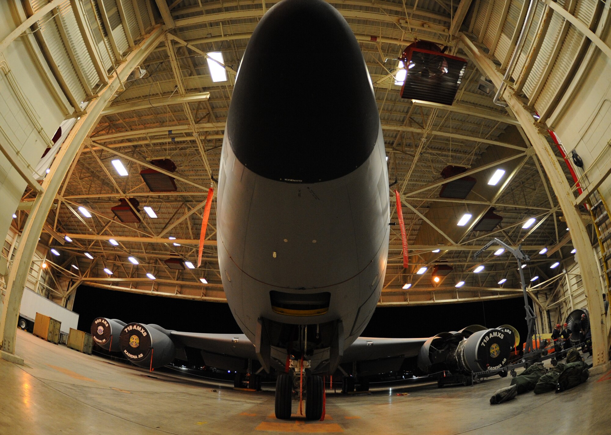 A KC-135 Stratotanker currently under maintenance sits inside a hanger during a Mission Focused Exercise on Kadena Air Base, Japan, Jan. 28, 2014. By honing skills during simulated war-time scenarios, the Airmen of the 18th Wing maintain contingency readiness.  (U.S. Air Force photo by Airman 1st Class Keith James)