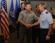 Gen. Hawk Carlisle, Pacific Air Forces commander, greets Gov. Eddie Calvo, the Governor of Guam, Jan. 27, 2014, immediately following Carlisle’s command brief at Joint Base Pearl Harbor-Hickam, Hawaii. Calvo along with Gov. Eloy Inos, the Governor of the Commonwealth of the Northern Mariana Island, and their staff, received a tour of the Court Yard of Heroes and had lunch with Carlisle. The visit focused on the mission and roles of PACAF and the rebalance to the Pacific.  (U.S. Air Force photo/Master Sgt. Matthew McGovern)  