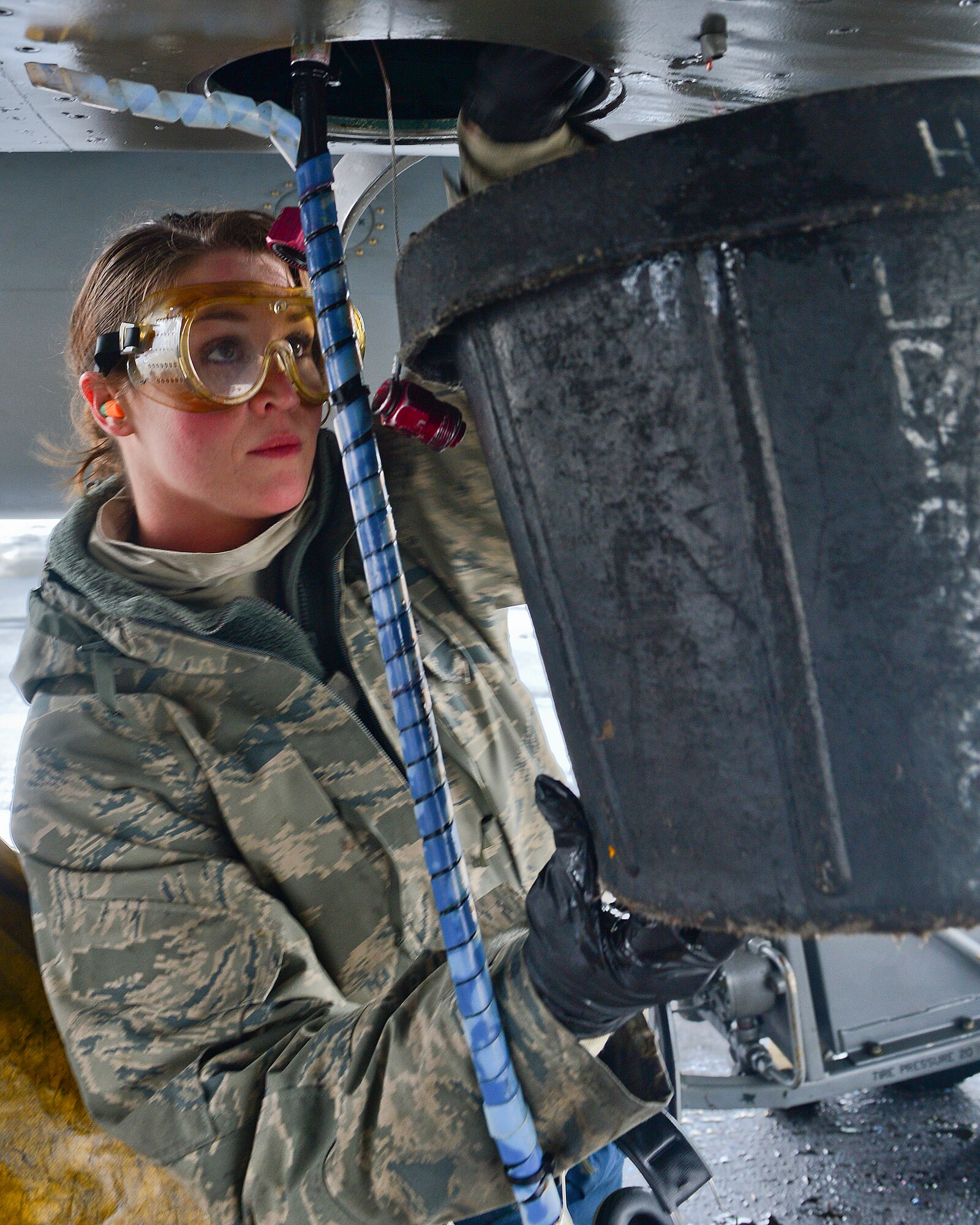 Staff Sgt. Carrie Quinn, 748th Aircraft Maintenance Squadron dedicated crew chief and a Las Vegas native, checks the engine oil of an F-15C Eagle during the Tactical Leadership Program in Albacete Air Base, Spain, Jan. 21, 2014. The 493rd Fighter Squadron is participating in the multi-national program which develops key leadership and mission-planning skills needed for NATO operations. Quinn was nominated for a Liberty Spotlight for portraying the core value “Service Before Self.” (U.S. Air Force photo by Staff Sgt. Stephanie Mancha/Released)