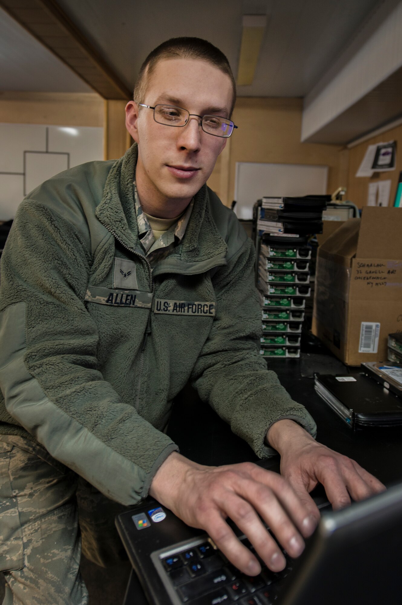 Airman 1st Class Josh Allen, 376th Expeditionary Communications Squadron help desk technician, troubleshoots a laptop screen issue at the Transit Center at Manas, Kyrgyzstan, Jan. 27, 2014. The turnaround time for work orders to be complete are, on average 35 minutes. (U.S. Air Force photo/Staff Sgt. Travis Edwards) 