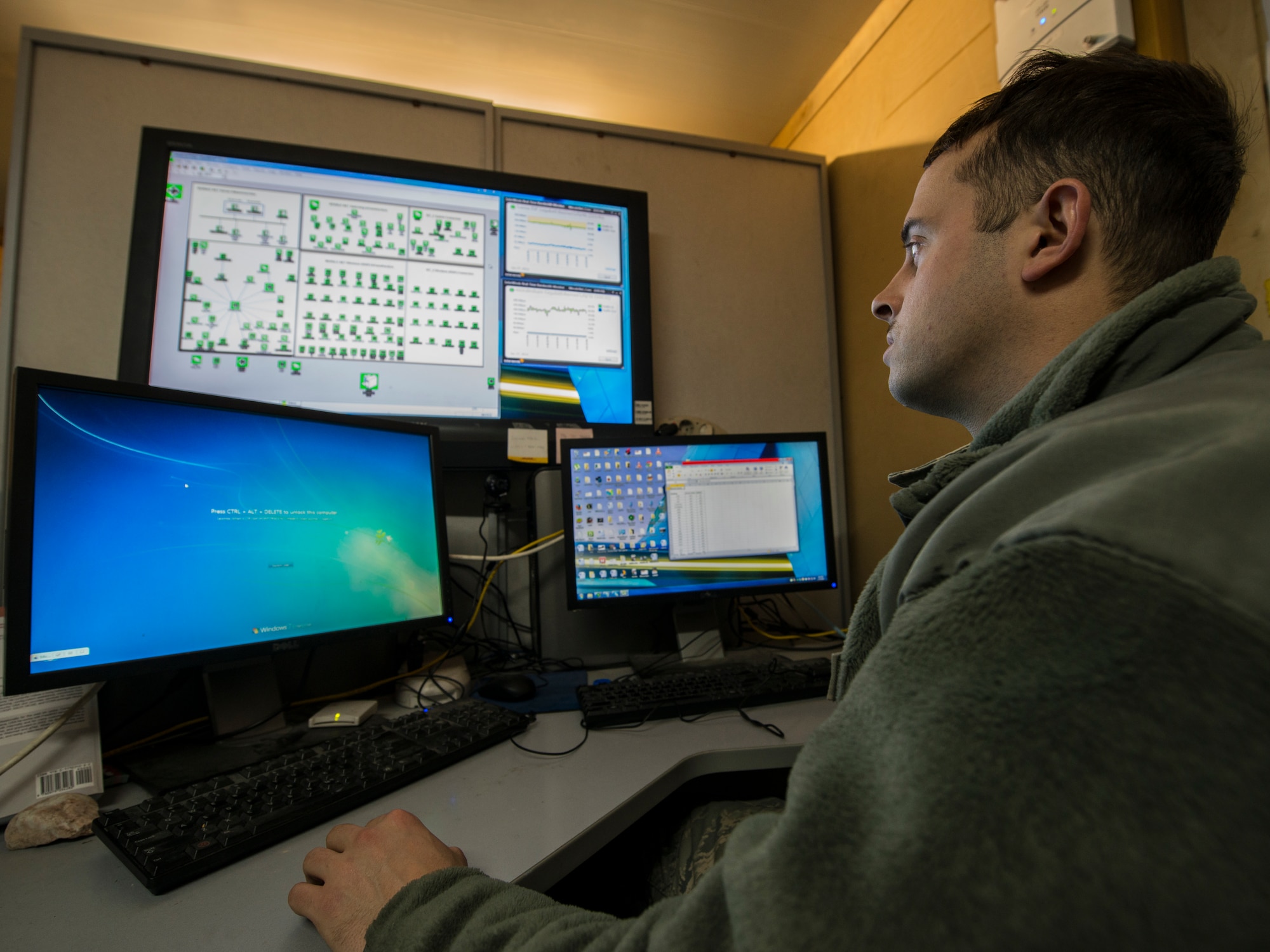 Airman 1st Class Thomas McKeghney, 376th Expeditionary Communications Squadron MoraleNet administrator and Wi-Fi technician, looks over the MoraleNet Wi-Fi system used at the Transit Center at Manas, Kyrgyzstan, Jan. 27, 2014. The Wi-Fi technician keeps tabs on more than 100 different Wi-Fi broadcasting terminals throughout the base. (U.S. Air Force photo/Staff Sgt. Travis Edwards