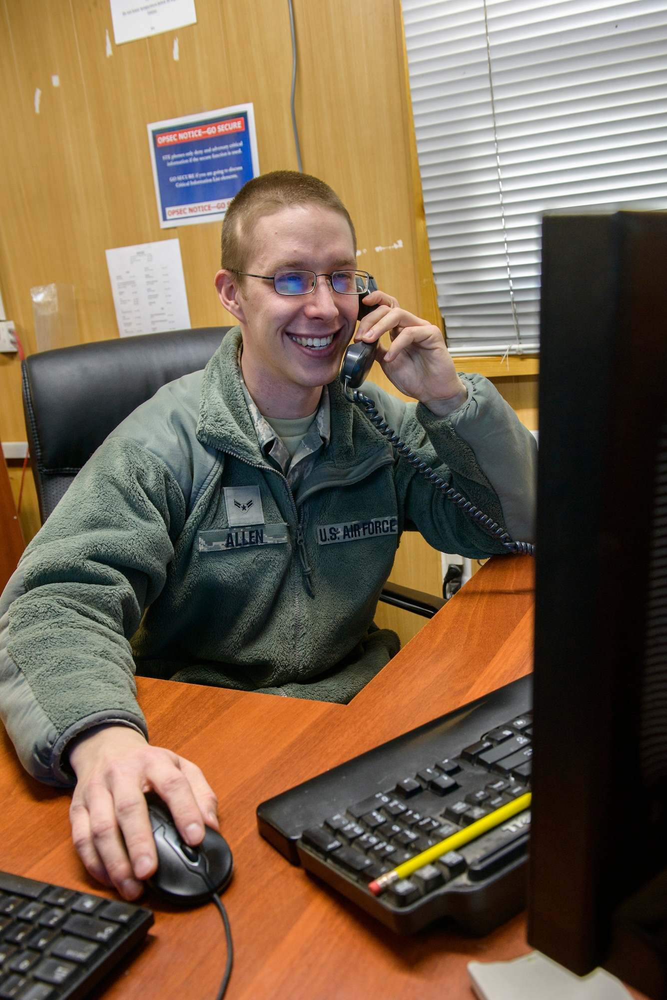 Airman 1st Class Josh Allen, 376th Expeditionary Communications Squadron help desk technician, answers a computer-related query on the phone Jan. 10, 2013, at the Transit Center at Manas, Kyrgyzstan.  In addition to answering a wide variety of questions over the phone, it is not uncommon for them to make a site visit to troubleshoot problems. Allen is deployed from  MacDill Air Force Base, Fla., and is a native of York, Penn. (U.S. Air Force photo/Staff Sgt. Travis Edwards)