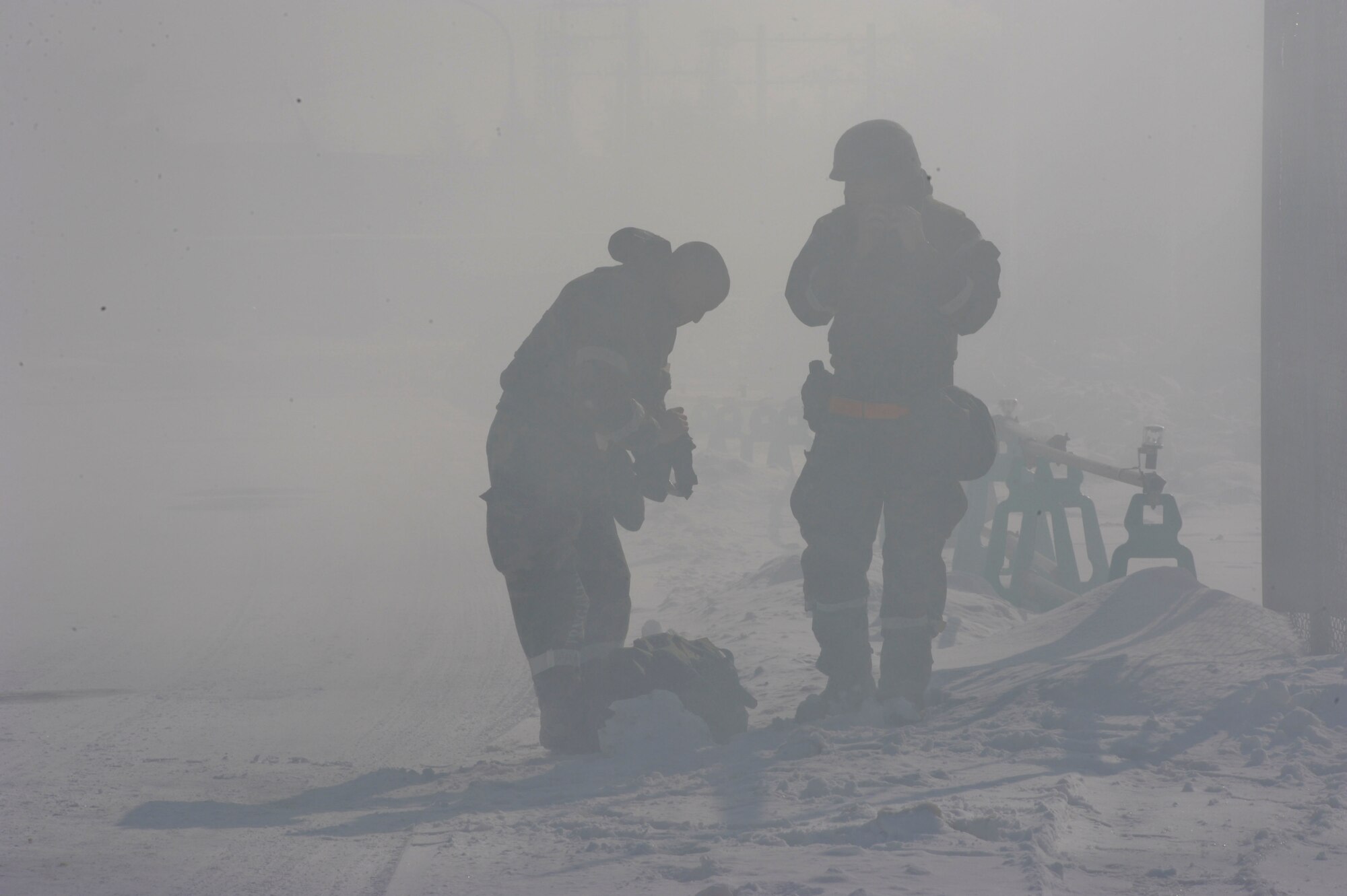 Airmen from the 35th Maintenance Squadron evacuate their work station after a simulated attack during Phase II of an operational readiness exercise at Misawa Air Base, Japan, Jan. 27, 2014. During an ORE, units are tested on their combat readiness and ability to execute the mission in a simulated deployed environment while working through disruptions and simulated attacks, known as injects. (U.S. Air Force photo/Staff Sgt. Alyssa C. Wallace)