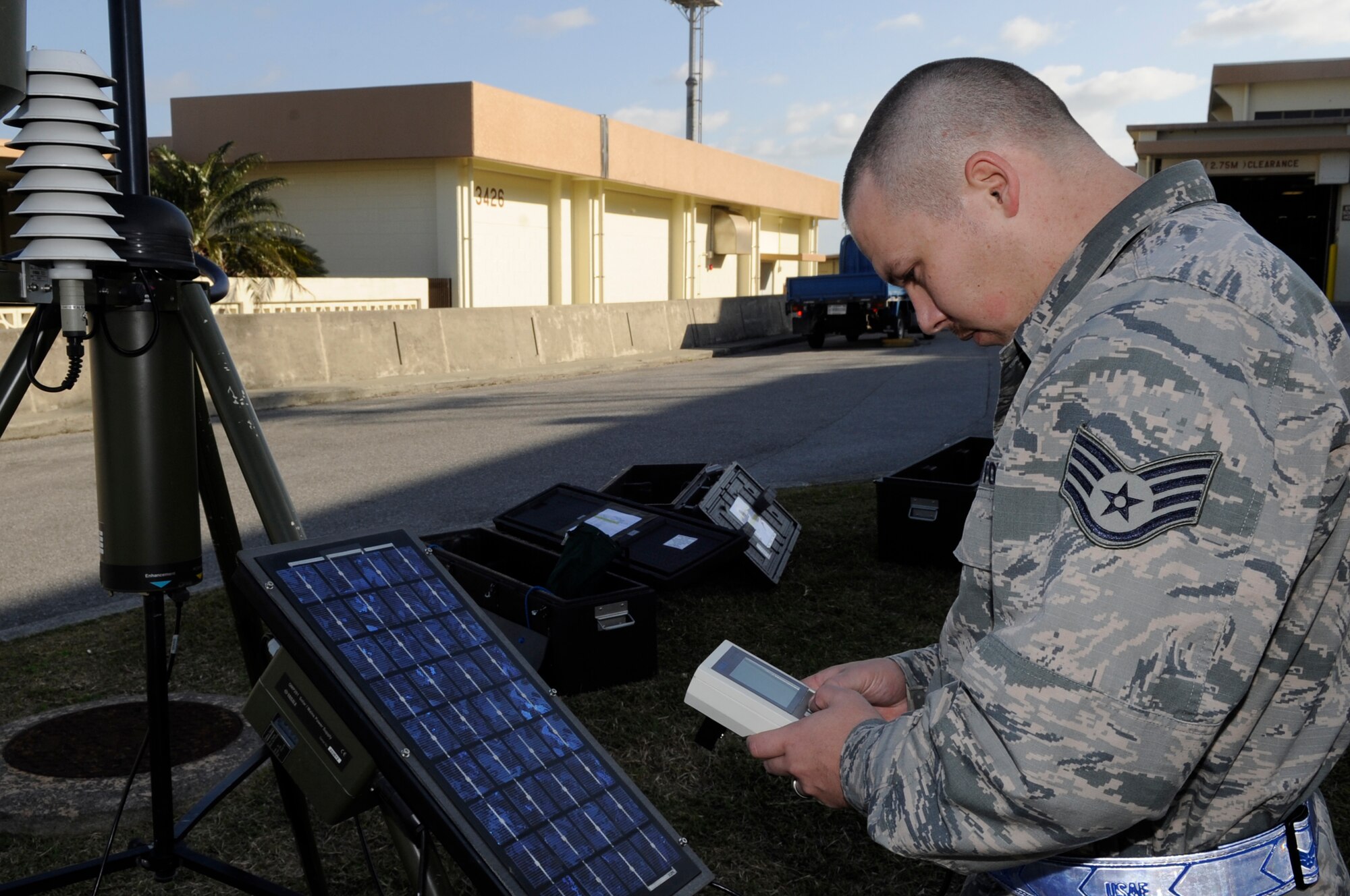 U.S. Air Force Staff Sgt. Chad Hooker, 18th Operations Support Squadron weather forecaster, calibrates a tactical meteorological observation system during a Mission Focused Exercise on Kadena Air Base, Japan, Jan. 28, 2014. The system uses low-earth orbiting satellites to collect data, enabling the transmission of mission-critical weather data within an hour after receiving it. (U.S. Air Force photo by Senior Airman Marcus Morris)
