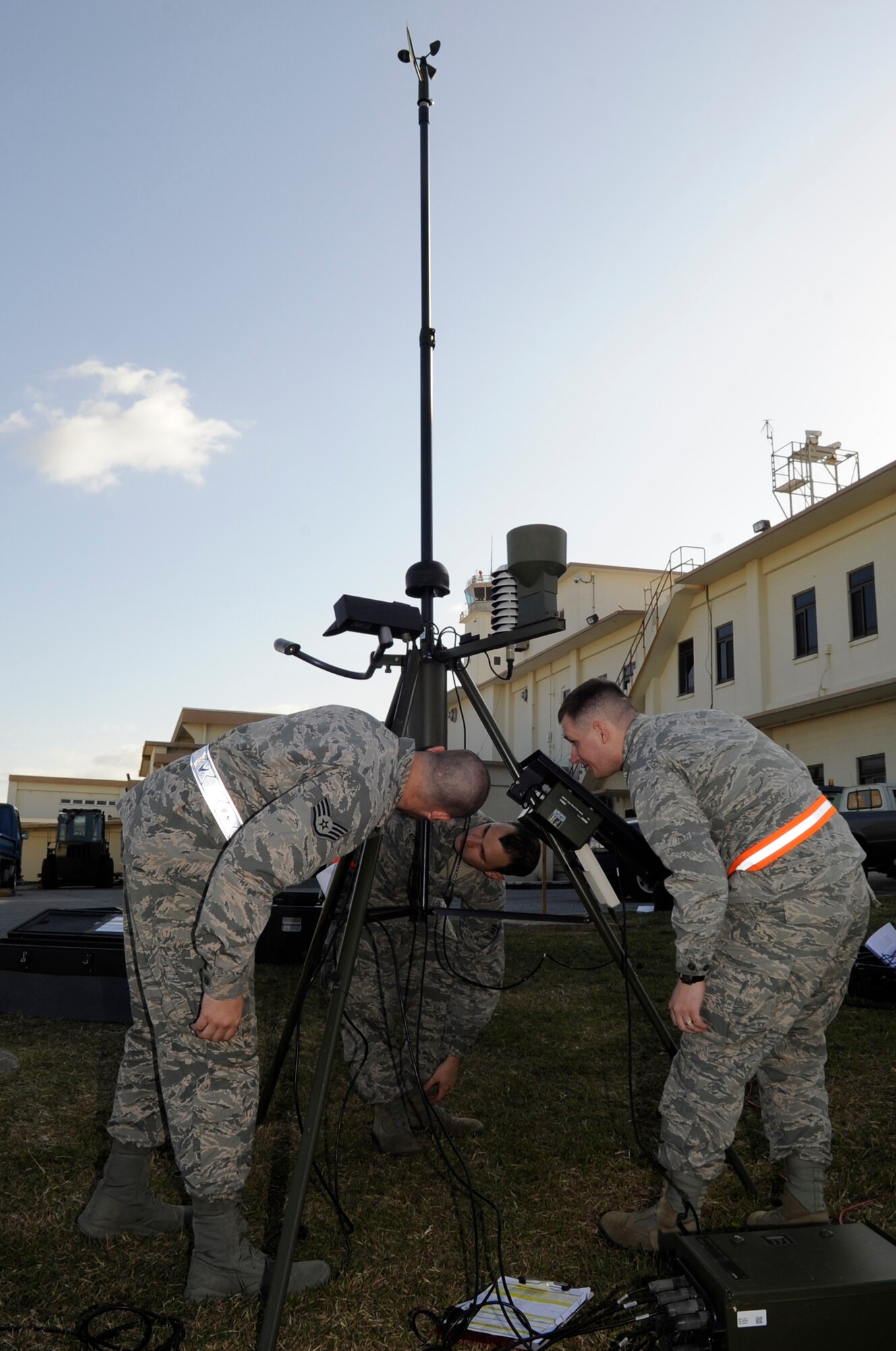 Weather forecasters from the 18th Operations Support Squadron level-out a tactical meteorological observation system during a Mission Focused Exercise on Kadena Air Base, Japan, Jan. 28, 2014. The system allows weather forecasters to continue the mission whether deployed or if their main system goes down. (U.S. Air Force photo by Senior Airman Marcus Morris)