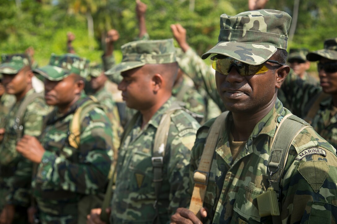 U.S. Marines give a safety briefing to Maldivian marines before live-fire training in Maafilaafushi, Maldives, Jan. 25, 2014. The U.S. Marines are assigned to U.S. Marine Corps Forces, Pacific. 