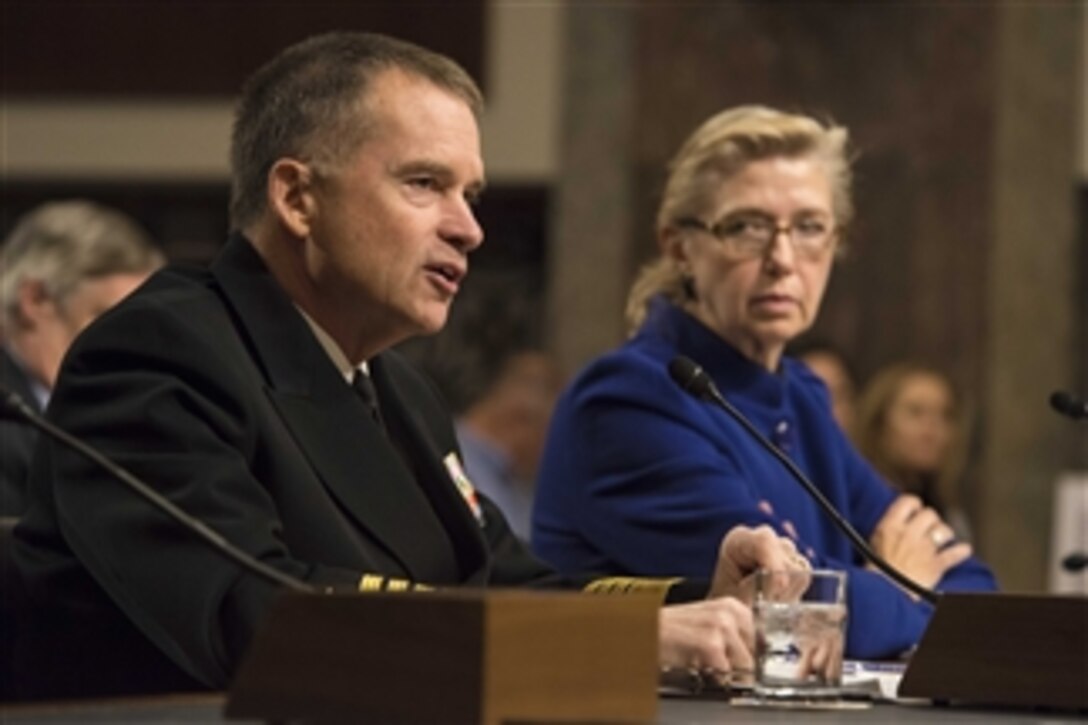 Navy Adm. James A. Winnefeld Jr., vice chairman of the Joint Chiefs of Staff, answers a question as Acting Deputy Defense Secretary Christine H. Fox looks on during testimony before the Senate Armed Services Committee in Washington, D.C., Jan. 28, 2014. Winnefeld and Fox addressed the current budget environment and possible requirement to slow the rate of growth in military compensation.