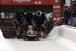 Former U.S. Army World Class Athlete Program bobsled driver Steven Holcomb (right) teams with Curtis Tomasevicz, Steven Langton and WCAP brakeman Capt. Christopher Fogt to win the four-man bobsled event at the International Bobsled & Skeleton Federation's 2013 World Cup stop Dec. 7 at Utah Olympic Park in Park City, Utah. Holcomb, the reigning Olympic four-man champion driver who spent seven years in the U.S. Army World Class Athlete Program, is 4-0 this World Cup season with two-man and four-man victories at Calgary, Canada, and Park City. U.S. Army photo by Tim Hipps, IMCOM Public Affairs