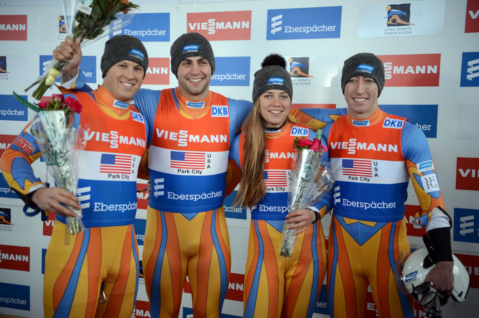 U.S. Army World Class Athlete Program luger Sgt. Matt Mortensen, Chris Mazdzer, Kate Hansen and WCAP Sgt. Preston Griffall display flowers after striking silver in the team relay race at the 2013 World Cup Luge stop Dec. 14 at Utah Olympic Park in Park City, Utah. Later that day, all four were named to the U.S. Olympic Luge Team that will compete at the 2014 Olympic Winter Games in Sochi, Russia. U.S. Army photo by Tim Hipps, IMCOM Public Affairs