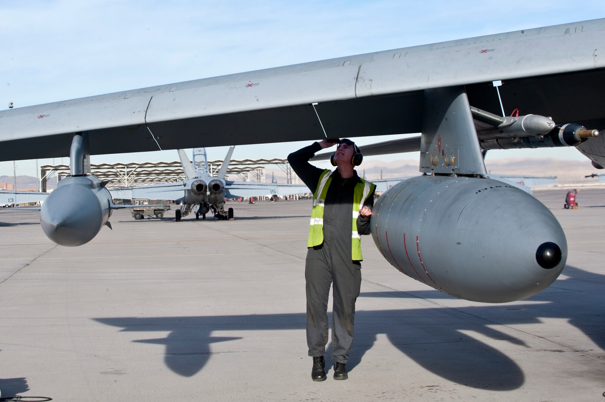 Royal Air Force Senior Air Craftsman Josh Dales performs post-flight checks during Red Flag 14-1 Jan. 27, 2014, at Nellis Air Force Base, Nev. Aircraft and personnel deploy to Nellis for Red Flag under the Air Expeditionary Force concept and make up the exercise's blue forces. Dales is an IX (B) Squadron aircraft maintenance mechanic from RAF Marham, United Kingdom. (U.S. Air Force photo/Senior Airman Matthew Lancaster)
 