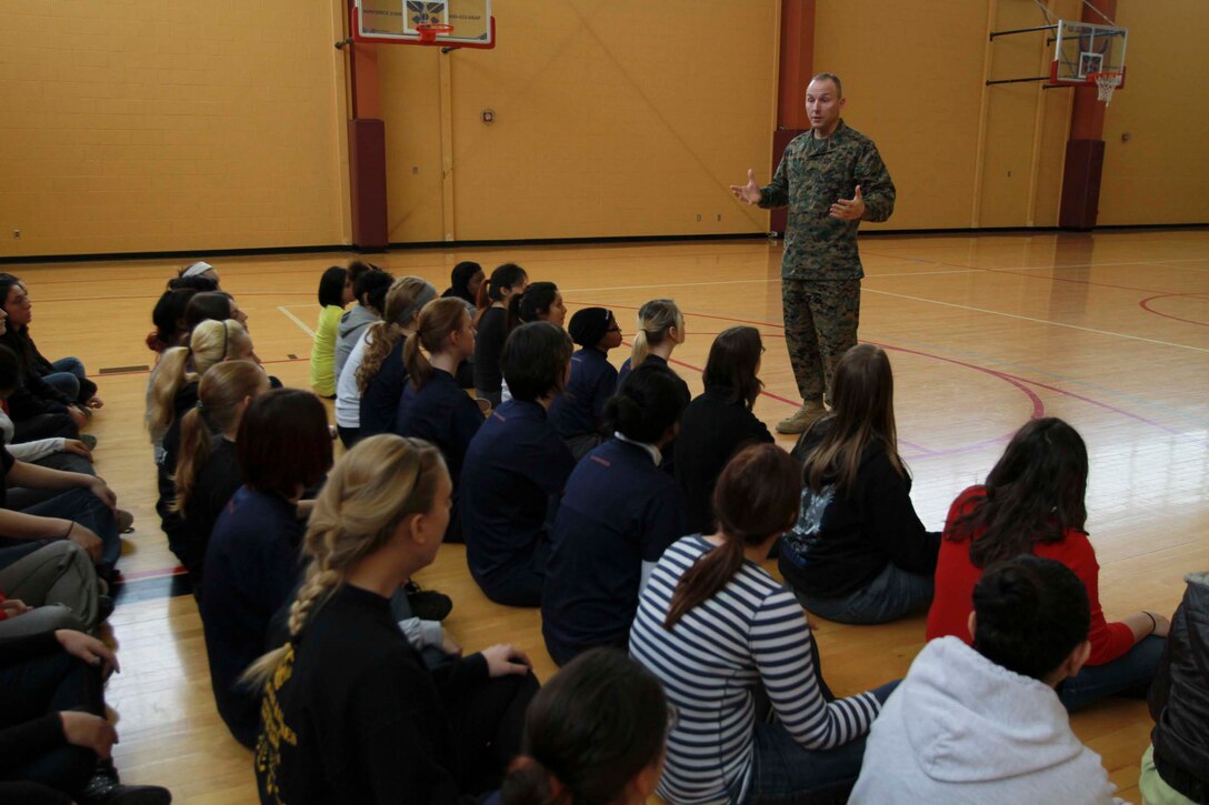 U.S. Marine Corps Sgt. Maj. Adam Yakubsin, Recruiting Station Detroit's sergeant major, speaks with recruits of Recruiting Station Detroit during a female pool function in Romulus, Mich., Jan. 18, 2014. The event was held to build camaraderie and spread knowledge about the Marine Corps. (Marine Corps photo by Sgt. Elyssa Quesada/ Released)