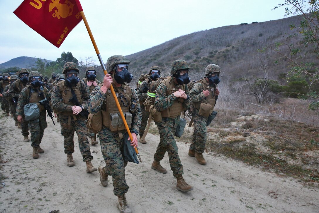 Marines with Combat Logistics Regiment 17, 1st Marine Logistics Group, conduct a combat conditioning hike aboard Camp Pendleton, Calif., Jan. 24, 2014. The almost 10-mile hike improved the regiment’s unit cohesion and combat readiness. To become comfortable using their M50 gas masks, the Marines hiked more than a mile wearing them. The hike was the fourth iteration of a series of hikes to condition the Marines and sailors. 