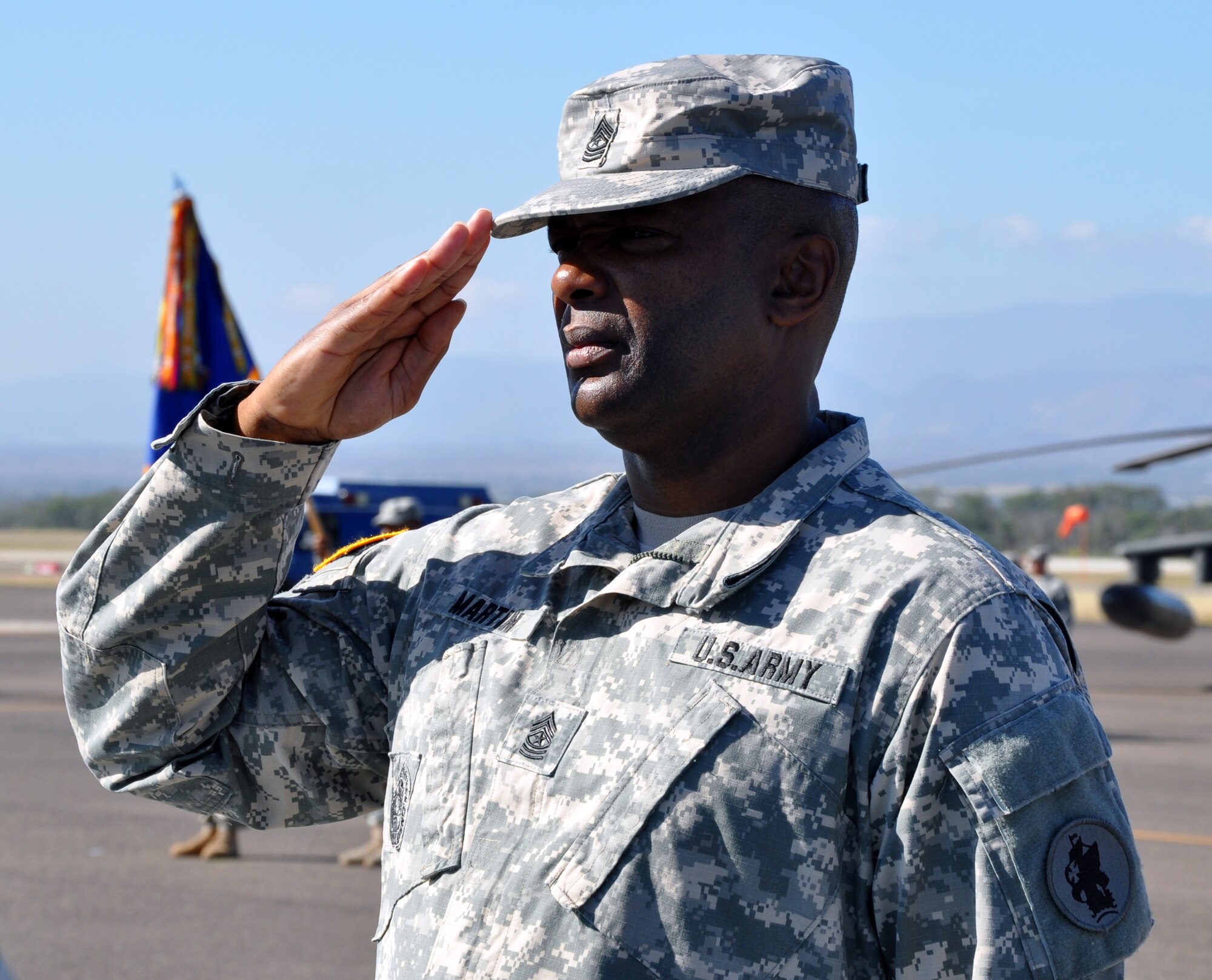 Joint Task Force-Bravo Command Sgt. Maj. Valmond A. Martin salutes the U.S. flag during a retirement ceremony conducted in his honor at Soto Cano Air Base, Honduras, Jan. 29, 2014.  Martin enlisted in the U.S. Army in 1983 and served the United States for more than 31 years.  (Photo by Martin Chahin)