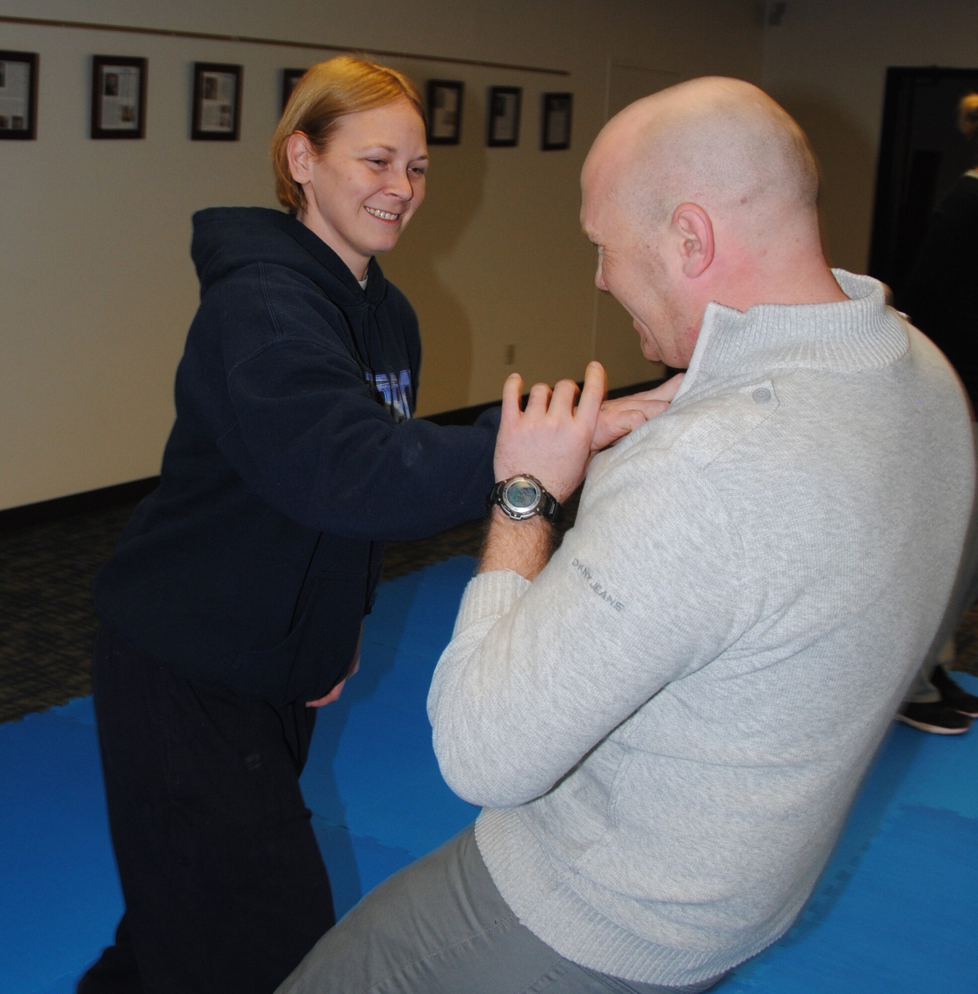 Capt. Gaye Bobbitt, left, a 71st Medical Group nurse, practices a self-defense technique on Navy Lt. Jonathan Kindel, a “My Body My Life” trainer, during a class held Jan. 21 in the Community Chapel Activity Center at Vance Air Force Base, Okla. (U.S. Air Force photo/ Senior Airman Frank Casciotta)