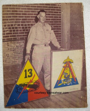 Maj. Gen. John Wogan, the 13th Armored Division commander from Oct., 1942 to April, 1945 stands next to the unit insignias. (Courtesy photo from toonsatwar.com/Released) 